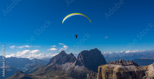 Paraglider flying over mountains 