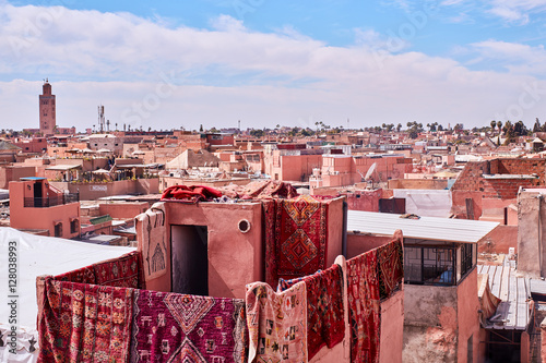 Carpets hanging from a roof in the Medina Marrakech photo