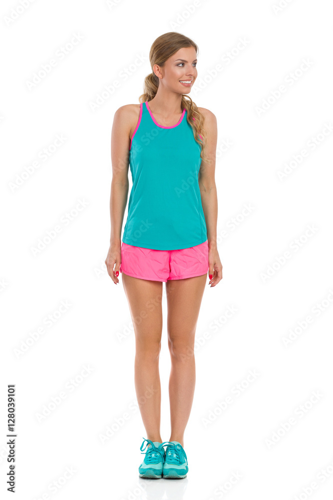 Woman In Sport Clothes Standing And Looking Away Woman In Sport Clothes Standing And Looking Away