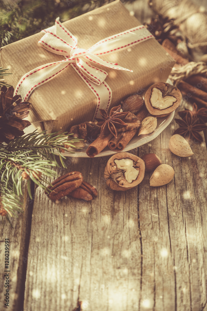 Fototapeta premium Christmas preasent nuts cinnamon ribbon