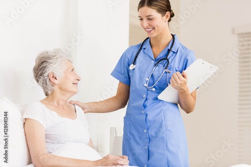 фотографія Doctor taking care of suffering senior patient