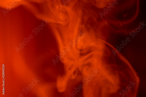 Vape smoke over red background