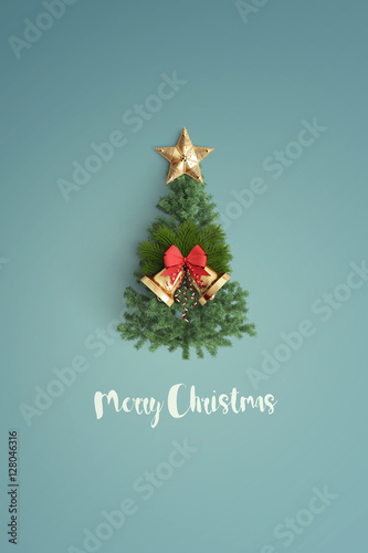 merry christmas and chirstmas tree on color background