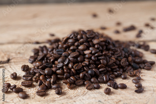Closeup of coffee beans with focus on one