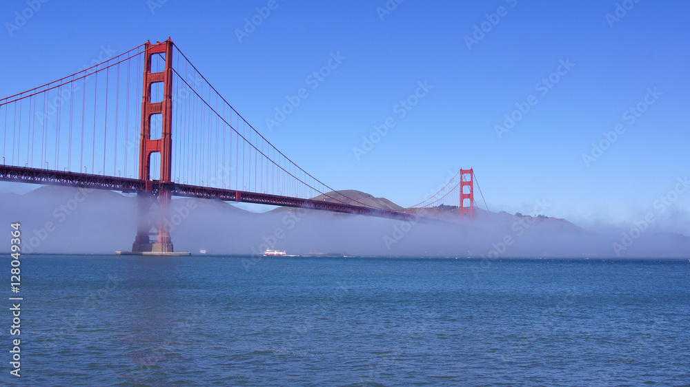 SAN FRANCISCO, USA - OCTOBER 5th, 2014: Golden Gate Bridge with heavy mist or fog as seen from Fort Point-