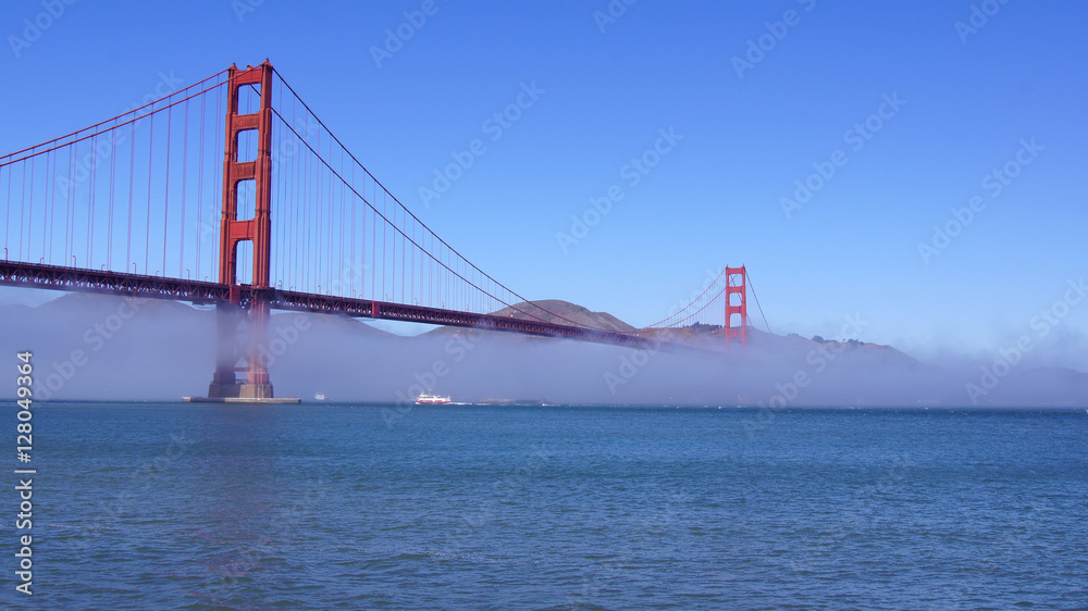 SAN FRANCISCO, USA - OCTOBER 5th, 2014: Golden Gate Bridge with heavy mist or fog as seen from Fort Point- SAN FRANCISCO, USA - OCTOBER 5th, 2014: Golden Gate Bridge with heavy mist or fog as seen from Fort Point-