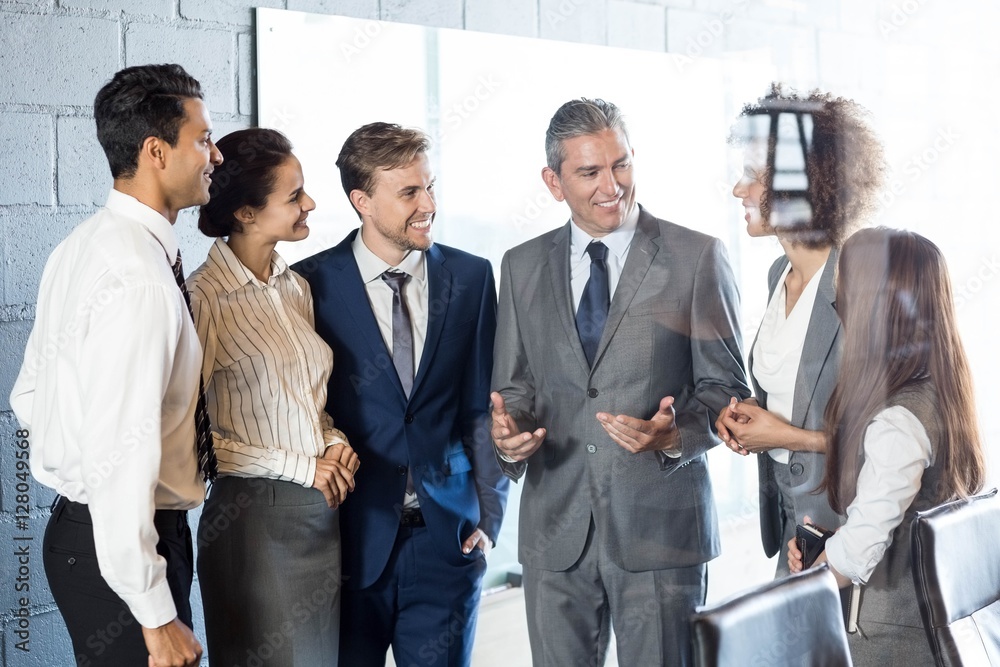 Businesspeople interacting in conference room Businesspeople interacting in conference room