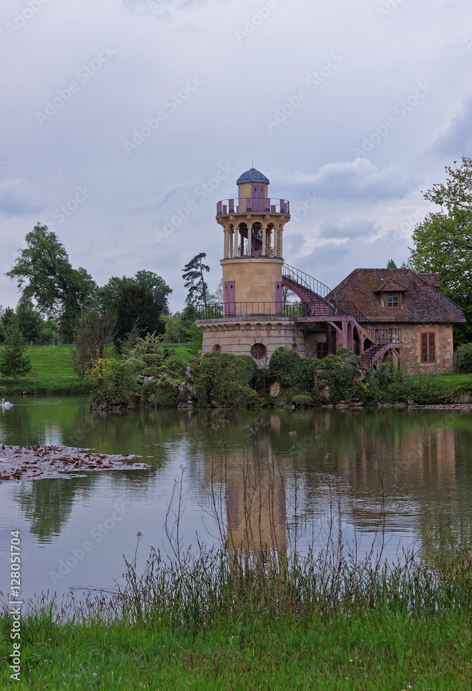 Lighthouse at lake in Old village of Marie Antoinette Versailles