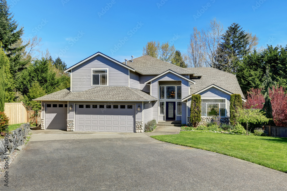 Traditional blue home exterior in Puyallup with wood siding Traditional blue home exterior in Puyallup with wood siding