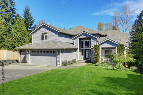 Traditional blue home exterior in Puyallup with wood siding