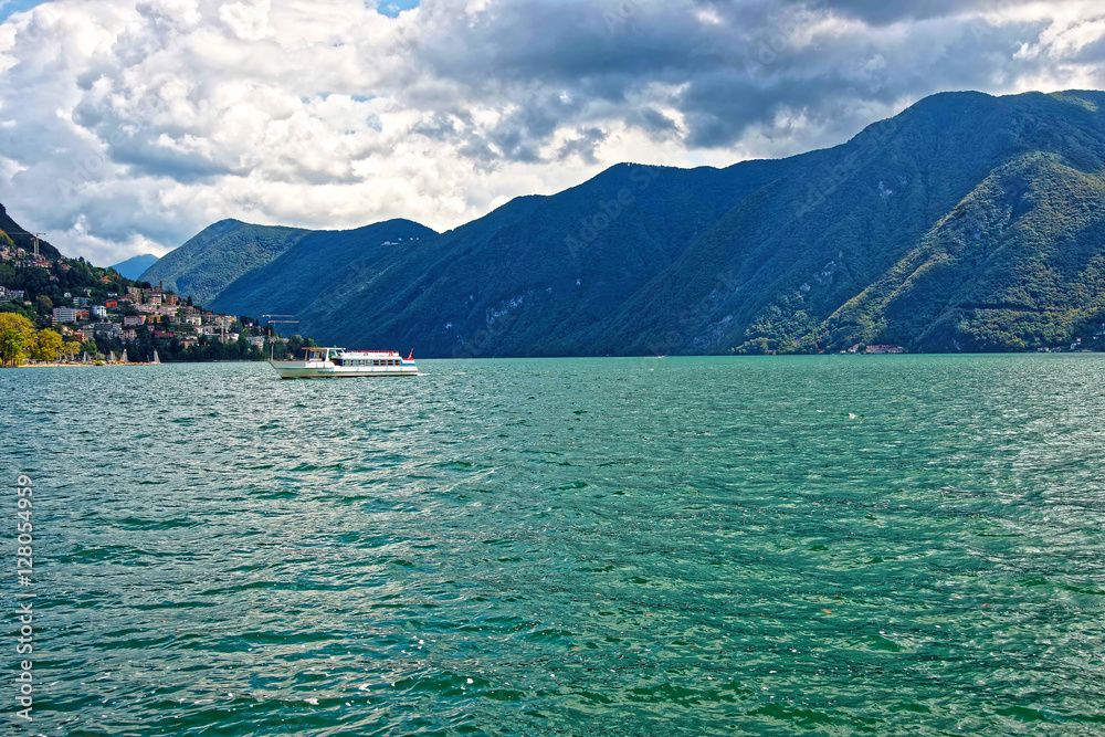 Small passenger ship at promenade in Lugano in Ticino Switzerland