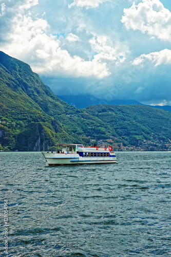Small passenger ship at promenade of Lugano in Ticino Switzerland