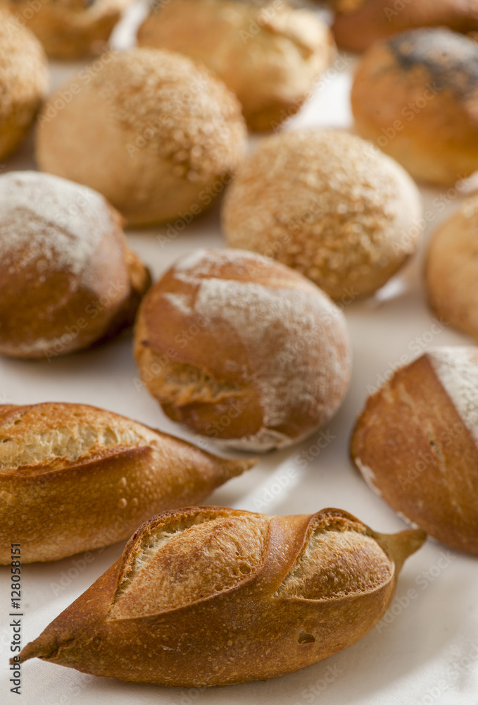 Small French bread rolls on table at the baker's