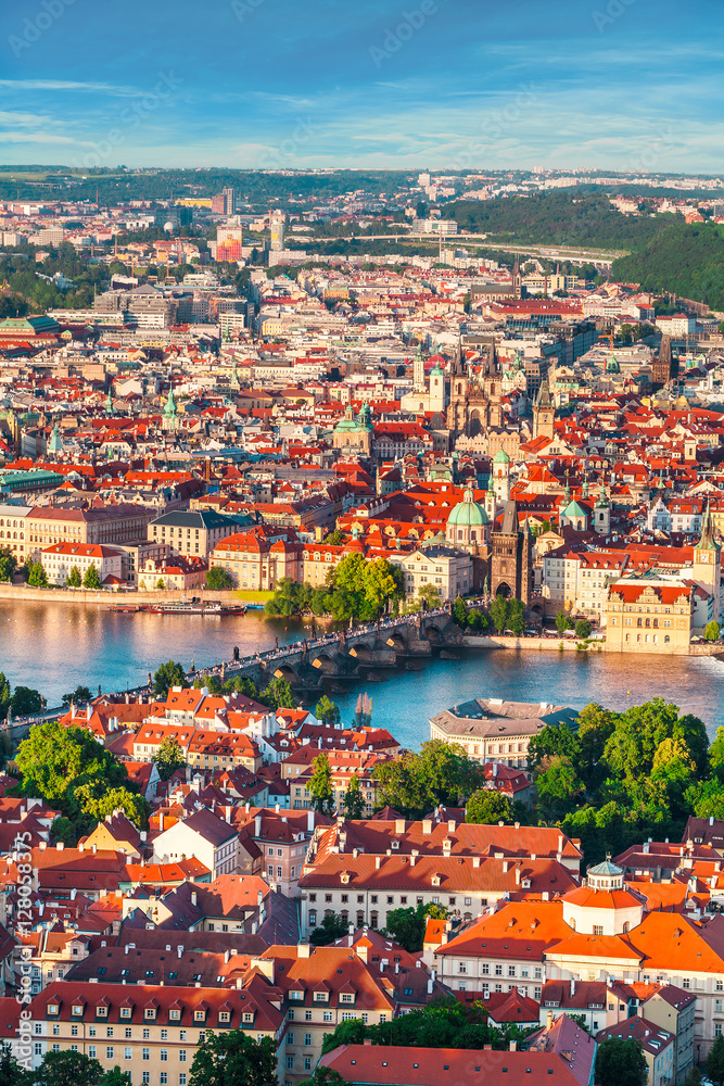 Panorama of the old part of Prague from the Petrin tower. Beautiful view on the bridges over the river Vltava at sunset. Old Town architecture, Czech Republic.