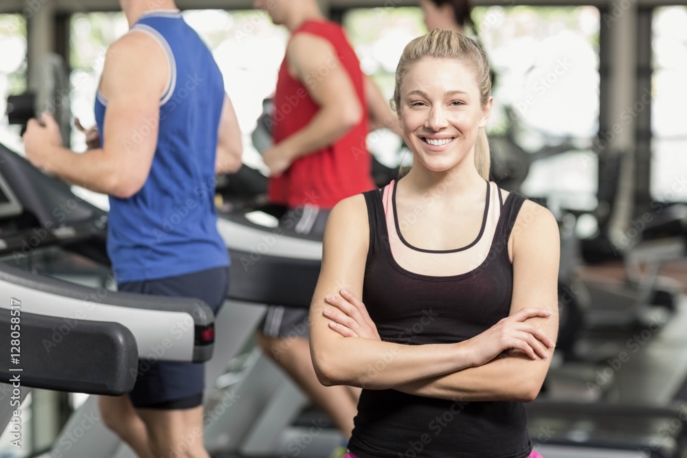 Fit woman posing with arms crossed