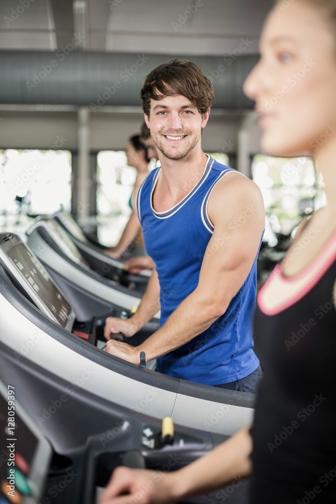 Athletic man running on treadmill