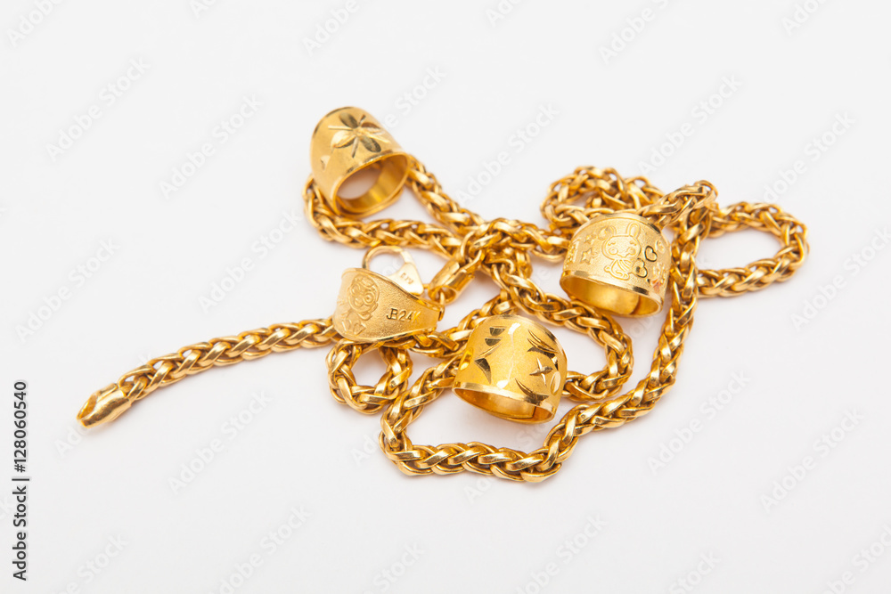 golden jewelry accessory on white backgrounds golden jewelry accessory on white backgrounds