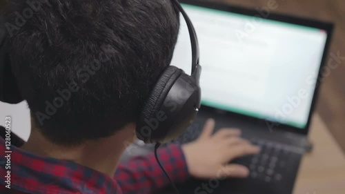 journalist in the headphones writes the text for videonews photo