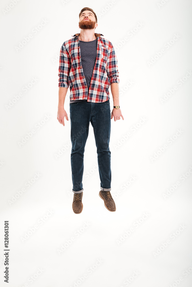 Casual young bearded man jumping Casual young bearded man jumping