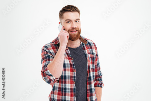 Portrait of a casual bearded man talking on the phone