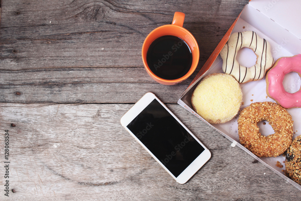 Fototapeta premium Donuts with espresso coffee and smart phone