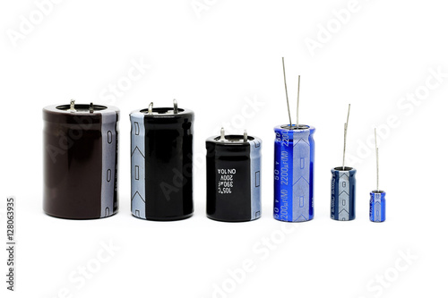 Group of capacitors different sizes isolated on white background. photo