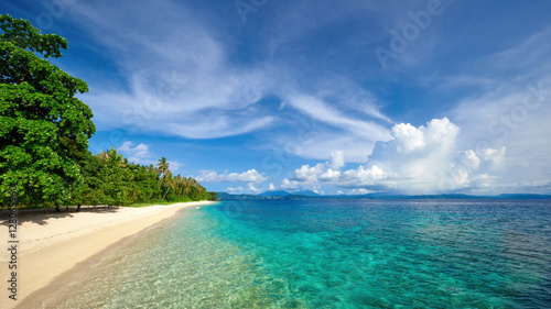 Beatiful panoramic view of tropical beach on background island.