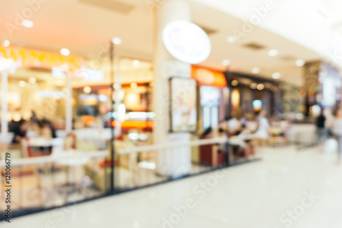 Blurred background - Store of shopping mall blur background with bokeh. vintage filtered image. © tirachard