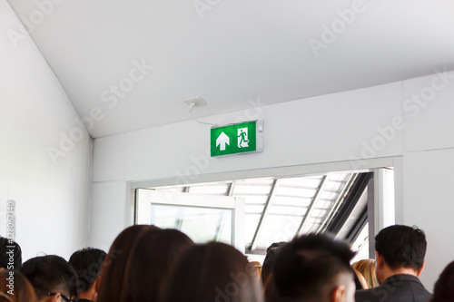 Obraz na plátně People escape to fire exit door