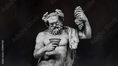 Dionysus Sculpture Sculpture Slow Motion on a Black Background photo