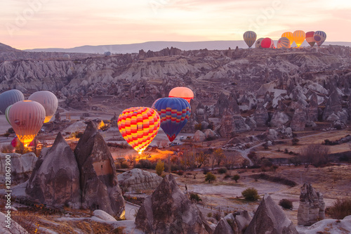 Vibrant sunrise landscape, Cappadocia ballooning early morning.