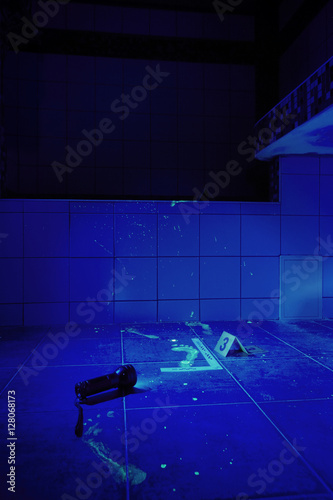 This bathroom is place of crime - hidden blood under ultra violet light