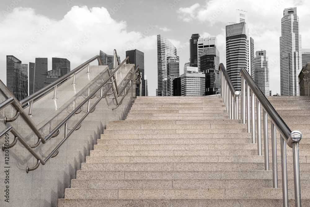 Obraz premium Marble staircase railing stainless steel with the skyscrapers background.