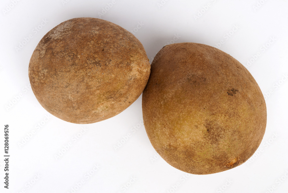 sapodilla plum with cut isolated on white. Manilkara zapota. Guatemala sapodilla plum with cut isolated on white. Manilkara zapota. Guatemala