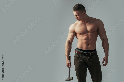 Canvas-taulu sexy muscular man with hammer