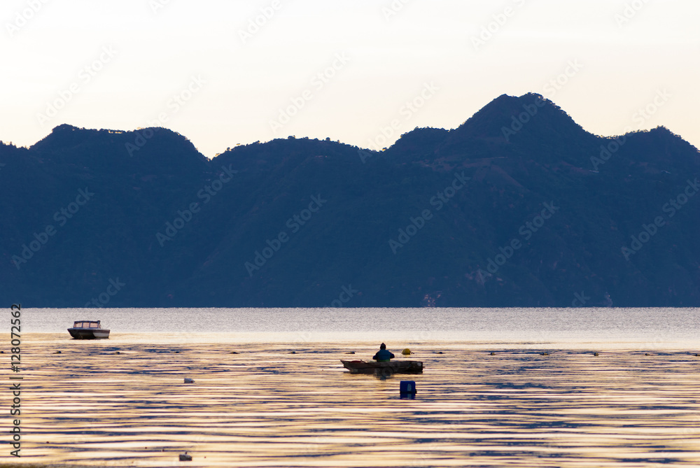 Atitlan Lake. Guatemala fisherman and volcano Atitlan Lake. Guatemala fisherman and volcano