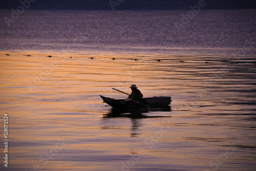 Atitlan Lake. Guatemala fisherman and volcano