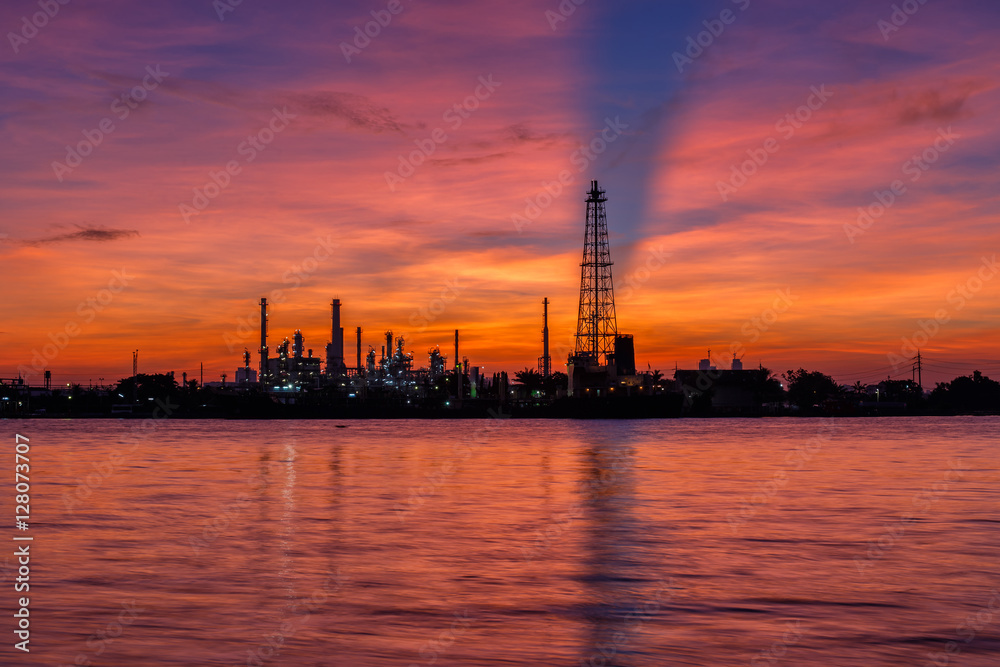 Oil refinery and surrounding communities at twilight