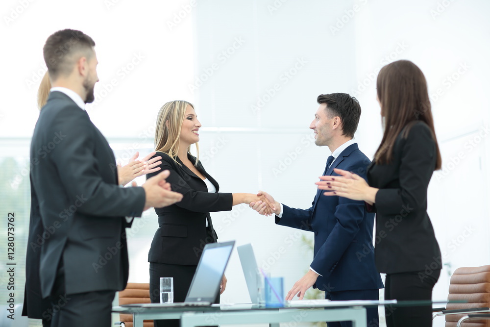 Business partner greeting each other with handshake Business partner greeting each other with handshake