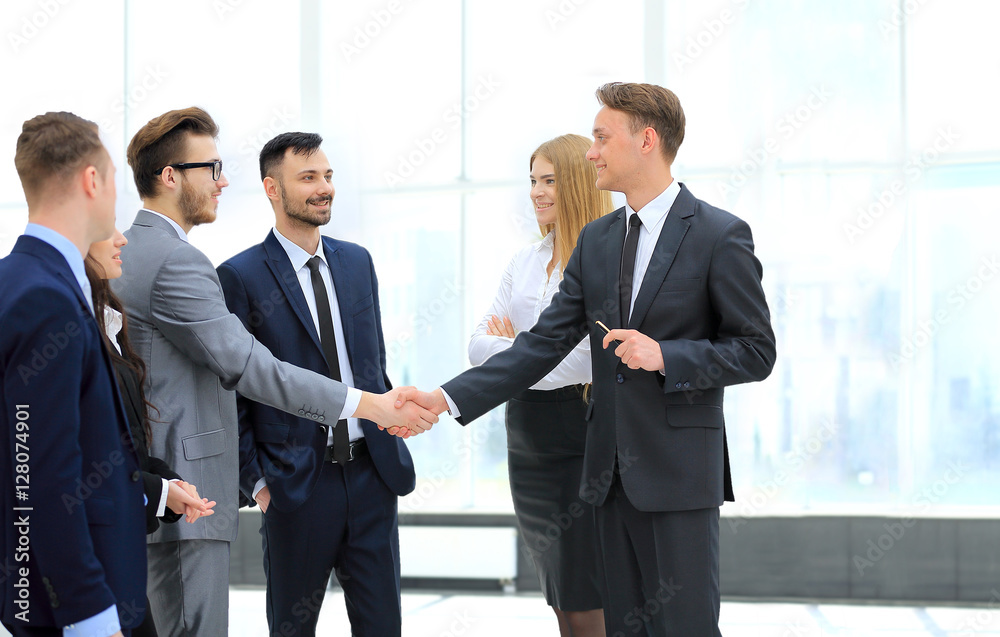 Business partner greeting each other with handshake Business partner greeting each other with handshake