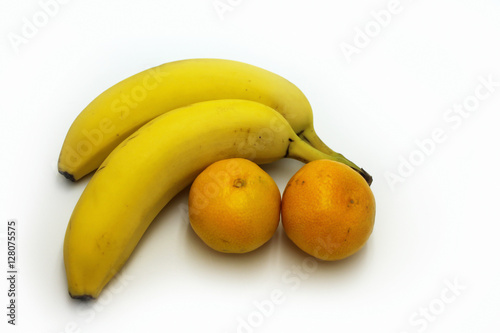 Bananas and tangerines on a white background
