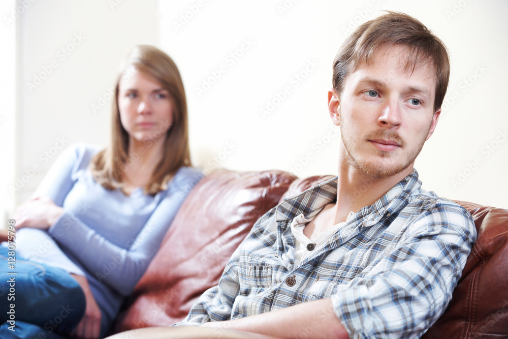 Couple With Relationship Difficulties Sitting On Sofa Couple With Relationship Difficulties Sitting On Sofa