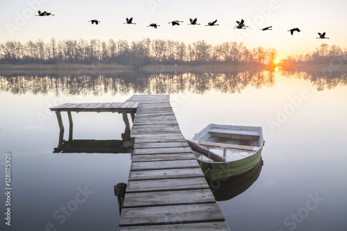 beautiful misty morning on the lake photo