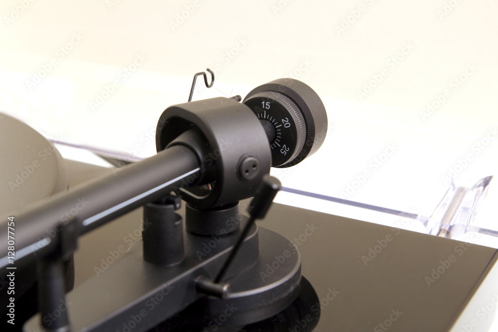 Tracking force adjustment wheel on a vinyl turntable record player Tracking force adjustment wheel on a vinyl turntable record player