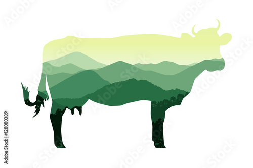 Silhouette of cow with mountain hills.