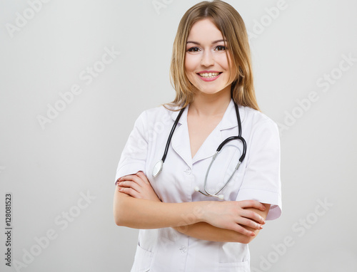 Beautiful nurse in white medical robe