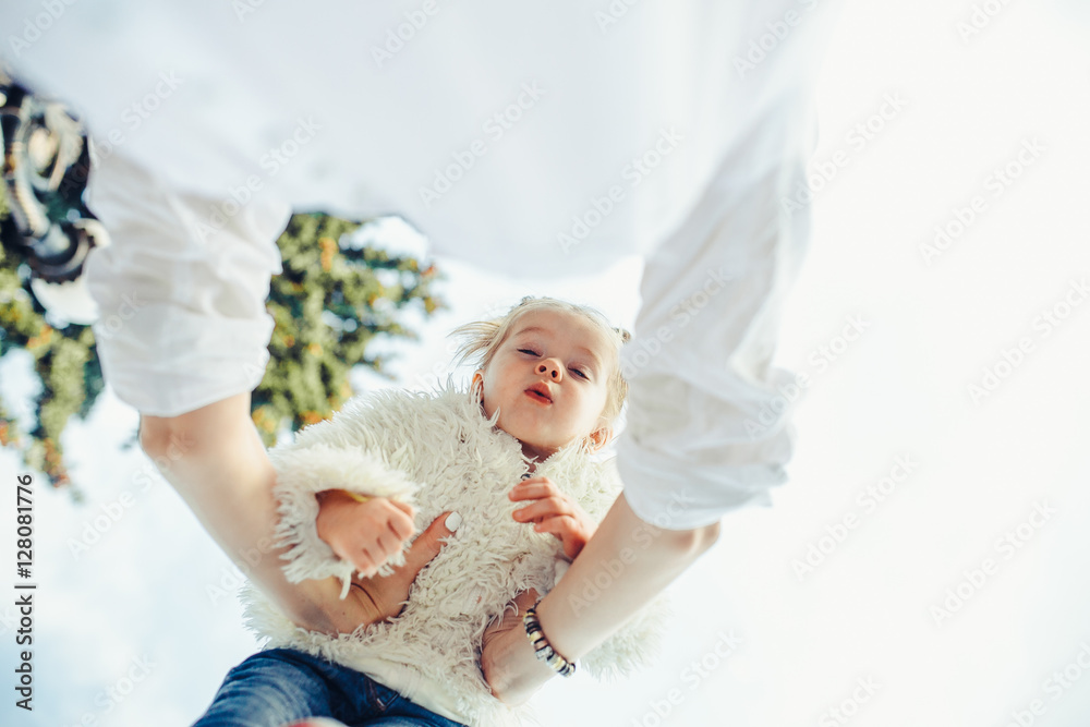 Mother and little daughter playing in a park Mother and little daughter playing in a park