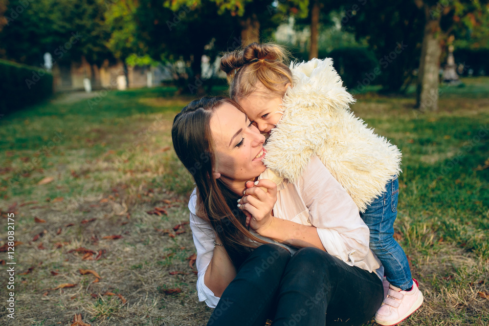 Mother and little daughter in a park Mother and little daughter in a park