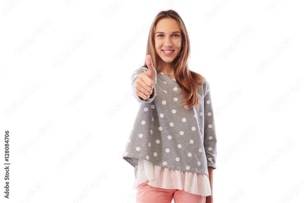 Happy smiling teenager giving the thumb up isolated on white bac Happy smiling teenager giving the thumb up isolated on white bac
