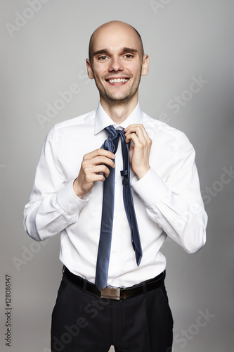Man Tying a Necktie